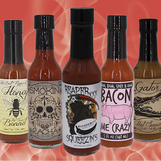 o	SHOP HOT SAUCES image of several hot sauces including Reaper Squeezins and Bacon me Crazy. Shop Sauces Now