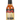 A bottle of The Last Dab Apollo hot sauce features a black cap, a label with red flames and yellow text, highlighting the intense heat of the Apollo Pepper.