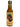 A 5 fl oz bottle of Char Man Pinya hot sauce features a cream-colored label with a woman’s profile, pineapples, and green leaves. The sauce, capped in green, delivers sweet heat in every drop.